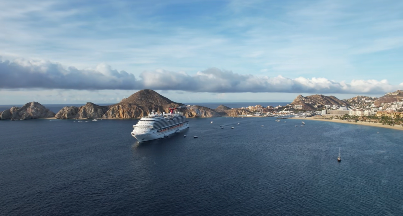 Cruise ship anchored in the bay at Cabo San Lucas with Land's End and Medano Beach in view